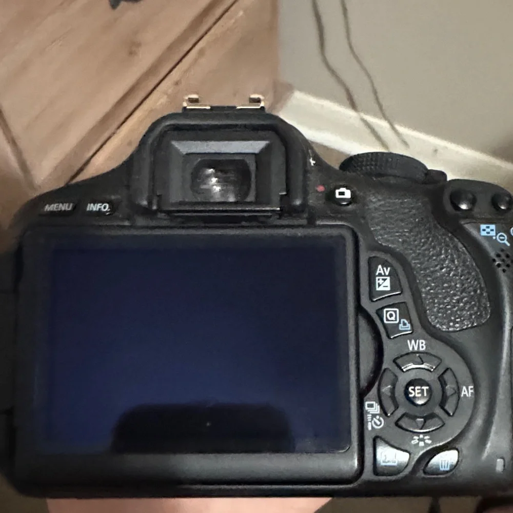 Canon Black DSLR with 18-55mm Kit Lens and Dual Battery Charger
